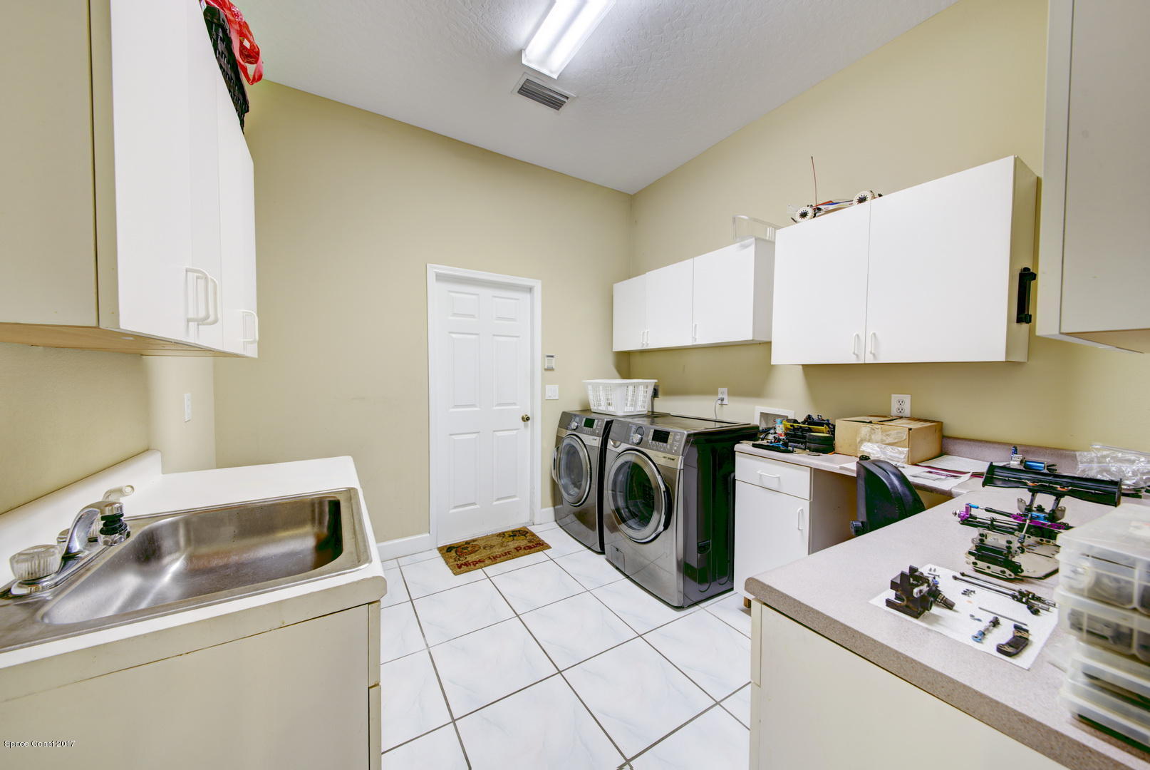 4055 Turtle Mound Road Melbourne, FL 32934 - Photo 55 of 80 Laundry Utility Room with Built-in Desk