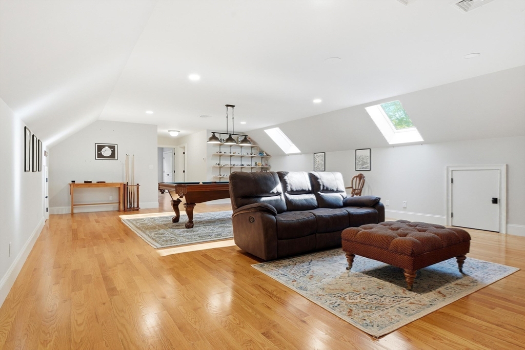 6 Flintlock Road Lexington, MA 02420 - Photo 32 of 39 a living room with furniture and a rug