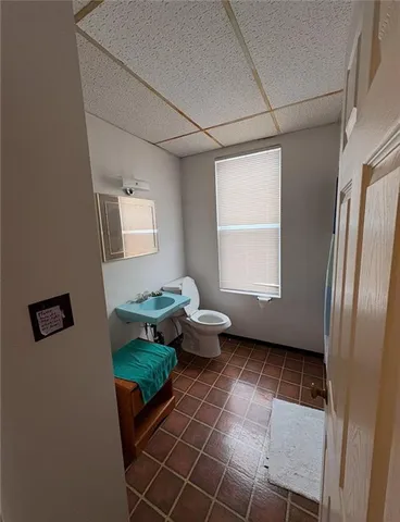 a living room with a couch and a window