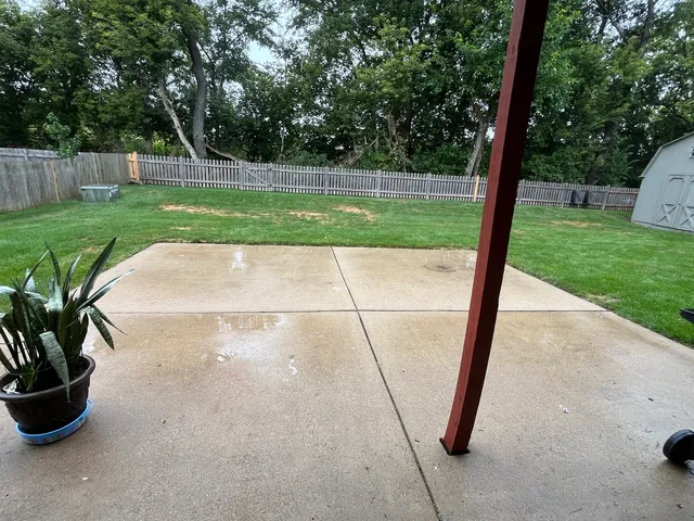 a view of a backyard with a sink and garden