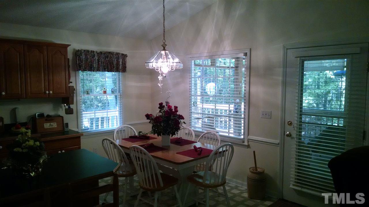 210 Nutbush Road Manson, NC 27553 - Photo 5 of 14 a view of a dining room with furniture and chandelier