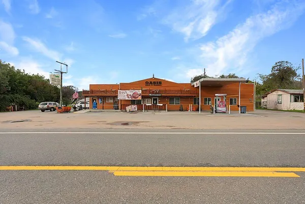 a view of building with a swimming pool and a yard