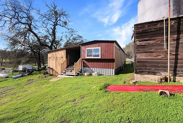 a view of outdoor space with wooden floor