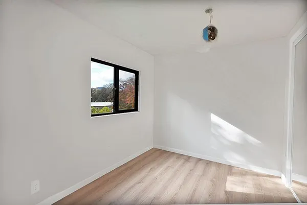 a view of livingroom with hardwood and furniture