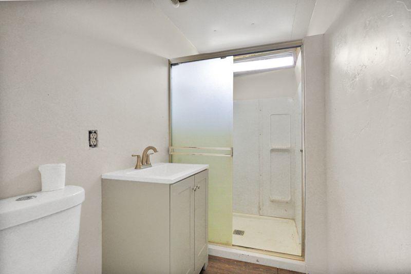 2675 Highway 140 Catheys Valley, CA 95306 - Photo 17 of 53 a bathroom with a sink a toilet and shower