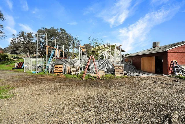 a view of yard with swimming pool