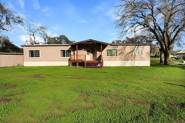 a view of a room with wooden floor and cabinet