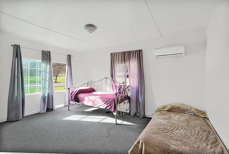 2675 Highway 140 Catheys Valley, CA 95306 - Photo 33 of 53 a bedroom with a bed and a window