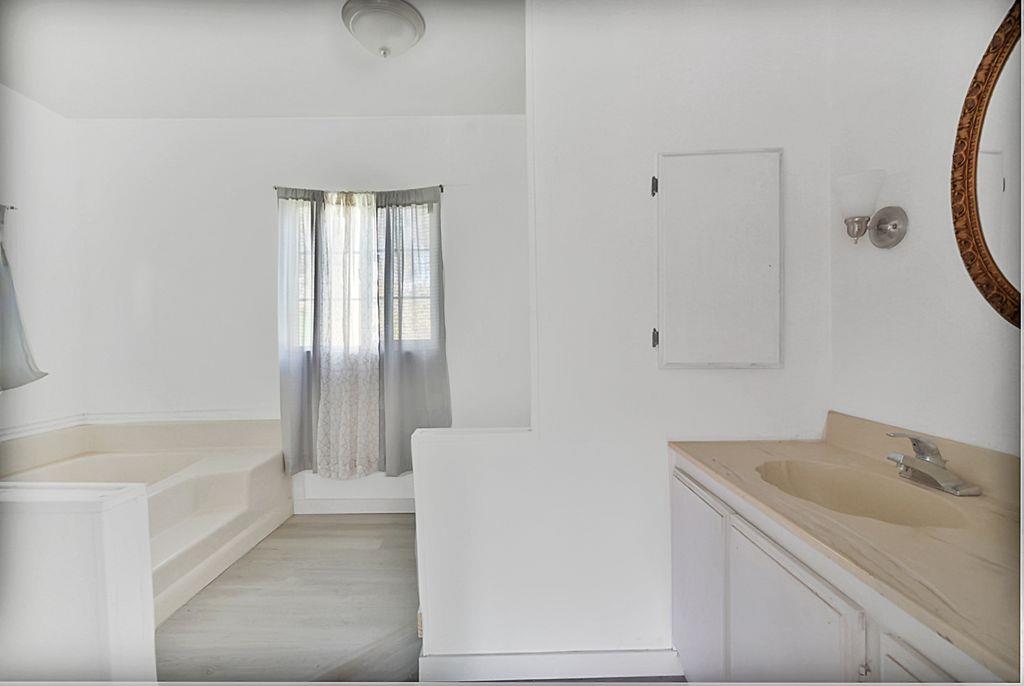 2675 Highway 140 Catheys Valley, CA 95306 - Photo 34 of 53 a bathroom with a bathtub and shower