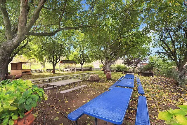 a view of a dining area with furniture and wooden floor