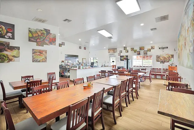 a room with lots of appliances and furniture