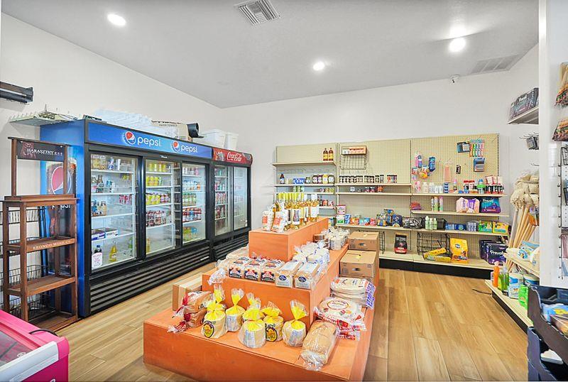 2675 Highway 140 Catheys Valley, CA 95306 - Photo 42 of 53 a room with lots of furniture and a book shelf