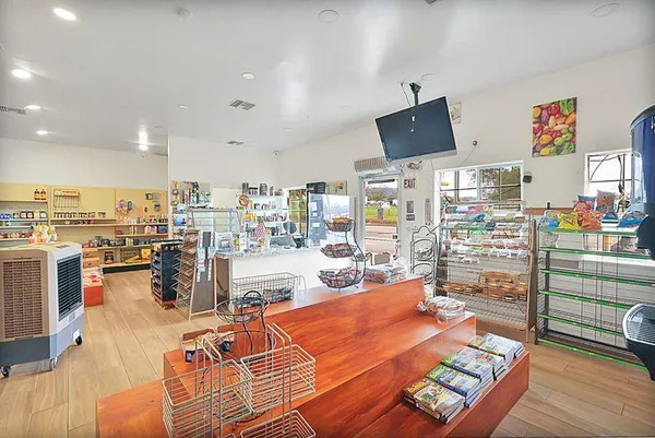 a kitchen with stainless steel appliances a stove and cabinets
