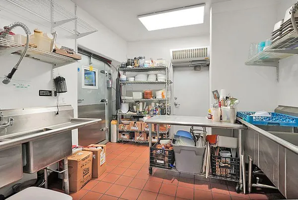 a view of a balcony with furniture