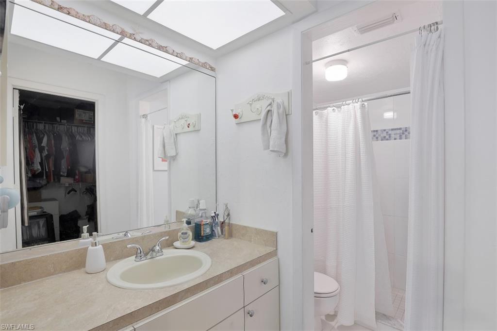 3400 Frosty Way, Unit 4704 Naples, FL 34112 - Photo 12 of 20 a bathroom with a sink toilet double vanity and shower