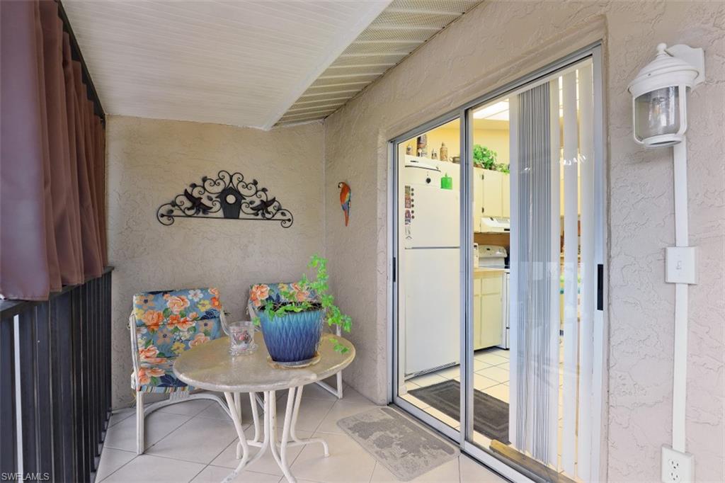 3400 Frosty Way, Unit 4704 Naples, FL 34112 - Photo 17 of 20 a view of a dining room with furniture window and outside view