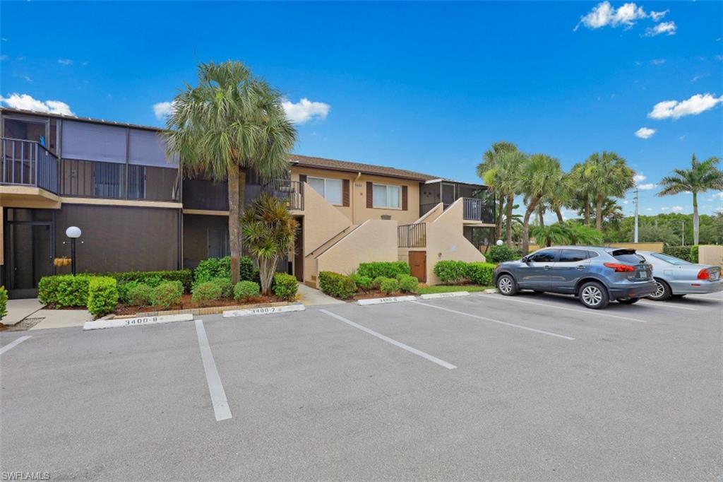 3400 Frosty Way, Unit 4704 Naples, FL 34112 - Photo 19 of 20 a view of a car parked in front of a house
