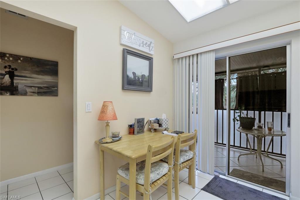 3400 Frosty Way, Unit 4704 Naples, FL 34112 - Photo 9 of 20 a view of a dining room with furniture