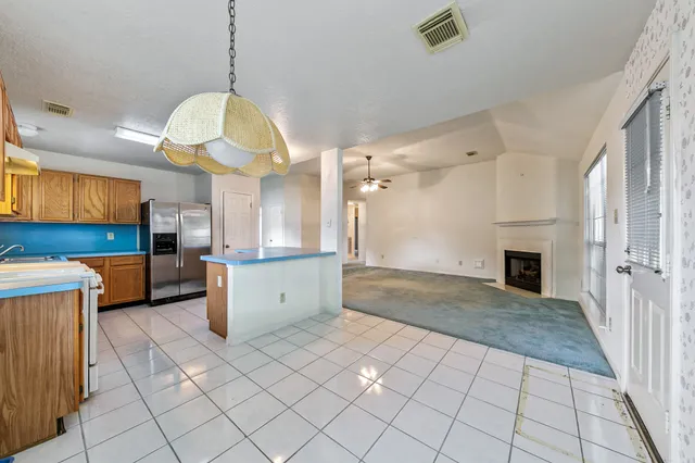 a view of a house with backyard and porch