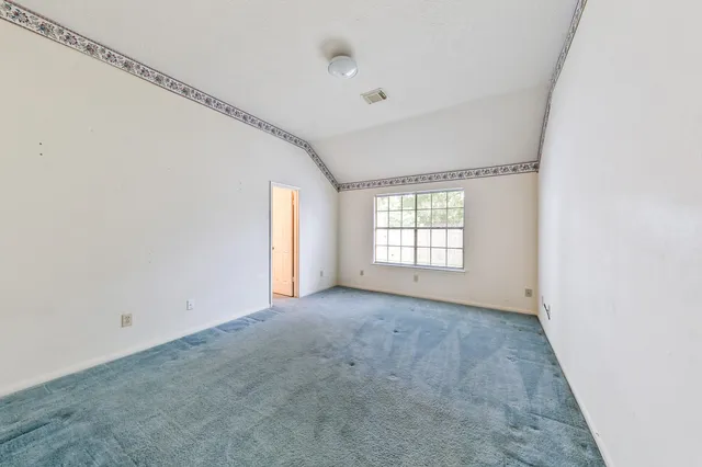 a kitchen that has a sink and a stove in it