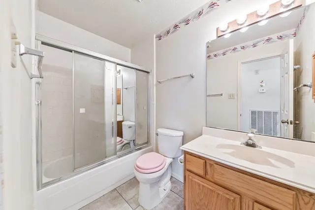 a spacious bathroom with sink shower and bathtub