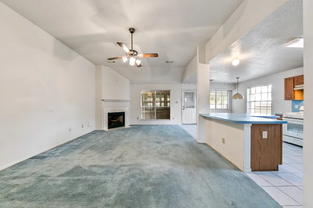 a large kitchen with kitchen island a sink stainless steel appliances and cabinets