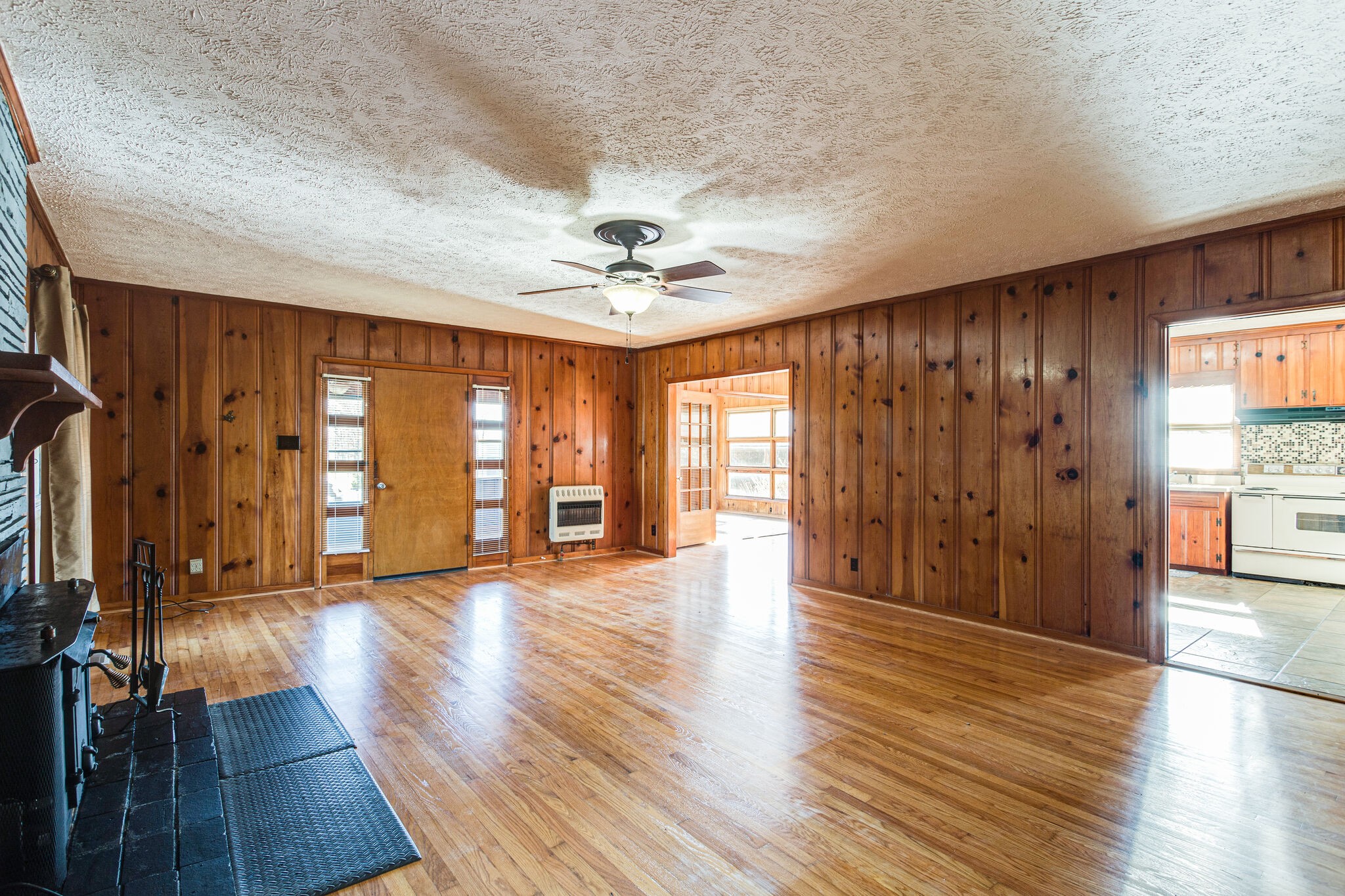 404 Monroe Floyd Road Decherd, TN 37324 - Photo 11 of 44 an empty room with wooden floor and windows