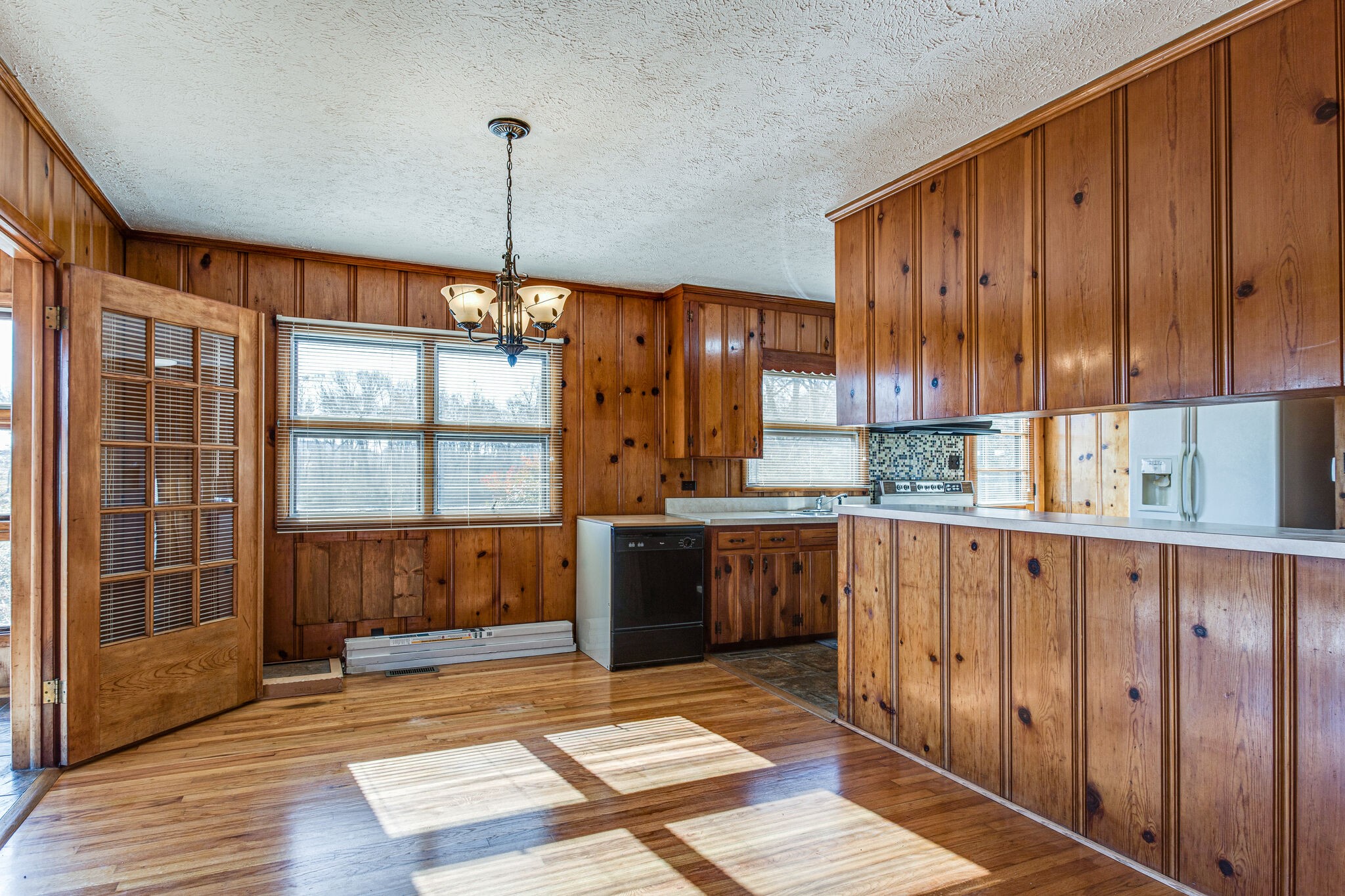 404 Monroe Floyd Road Decherd, TN 37324 - Photo 12 of 44 a kitchen with stainless steel appliances granite countertop a refrigerator and wooden cabinets