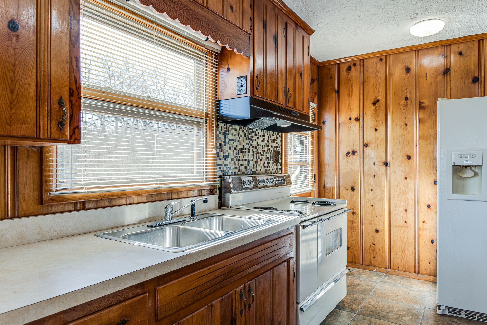 404 Monroe Floyd Road Decherd, TN 37324 - Photo 19 of 44 a kitchen with stainless steel appliances a sink and a window