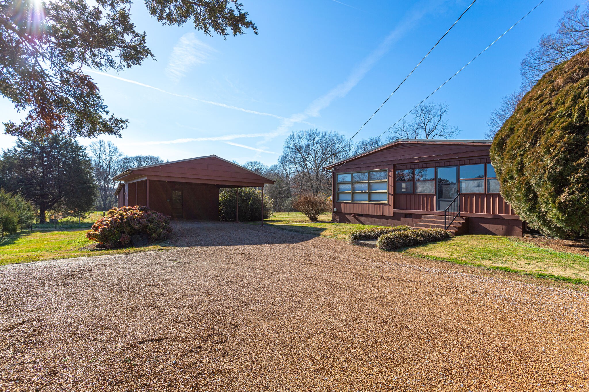 404 Monroe Floyd Road Decherd, TN 37324 - Photo 3 of 44 a view of a house with a yard and sitting area