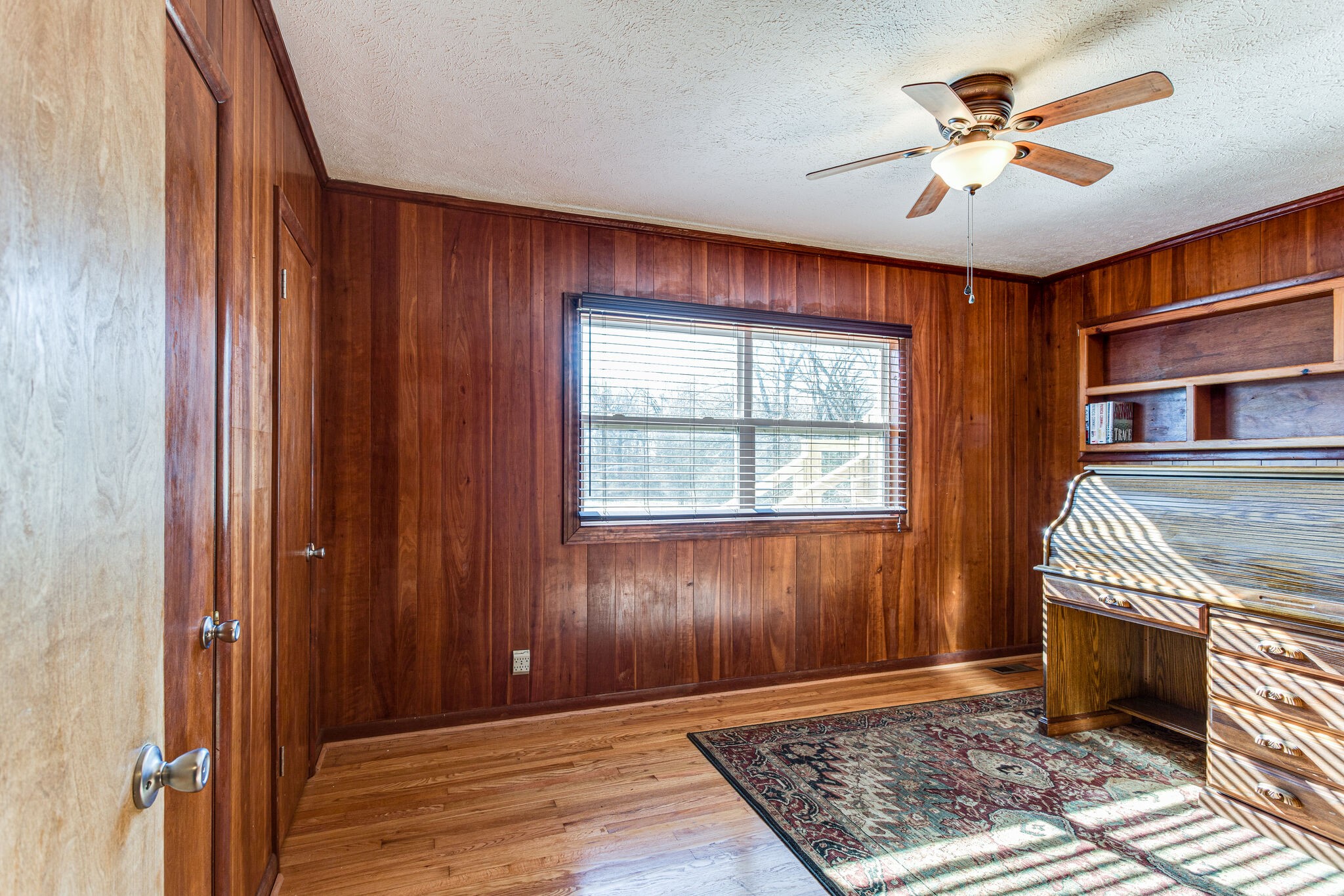 404 Monroe Floyd Road Decherd, TN 37324 - Photo 23 of 44 an empty room with windows chandelier fan and windows