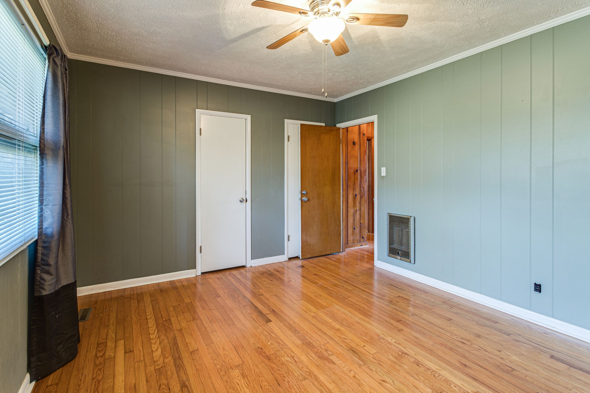 404 Monroe Floyd Road Decherd, TN 37324 - Photo 26 of 44 a view of an empty room with wooden floor