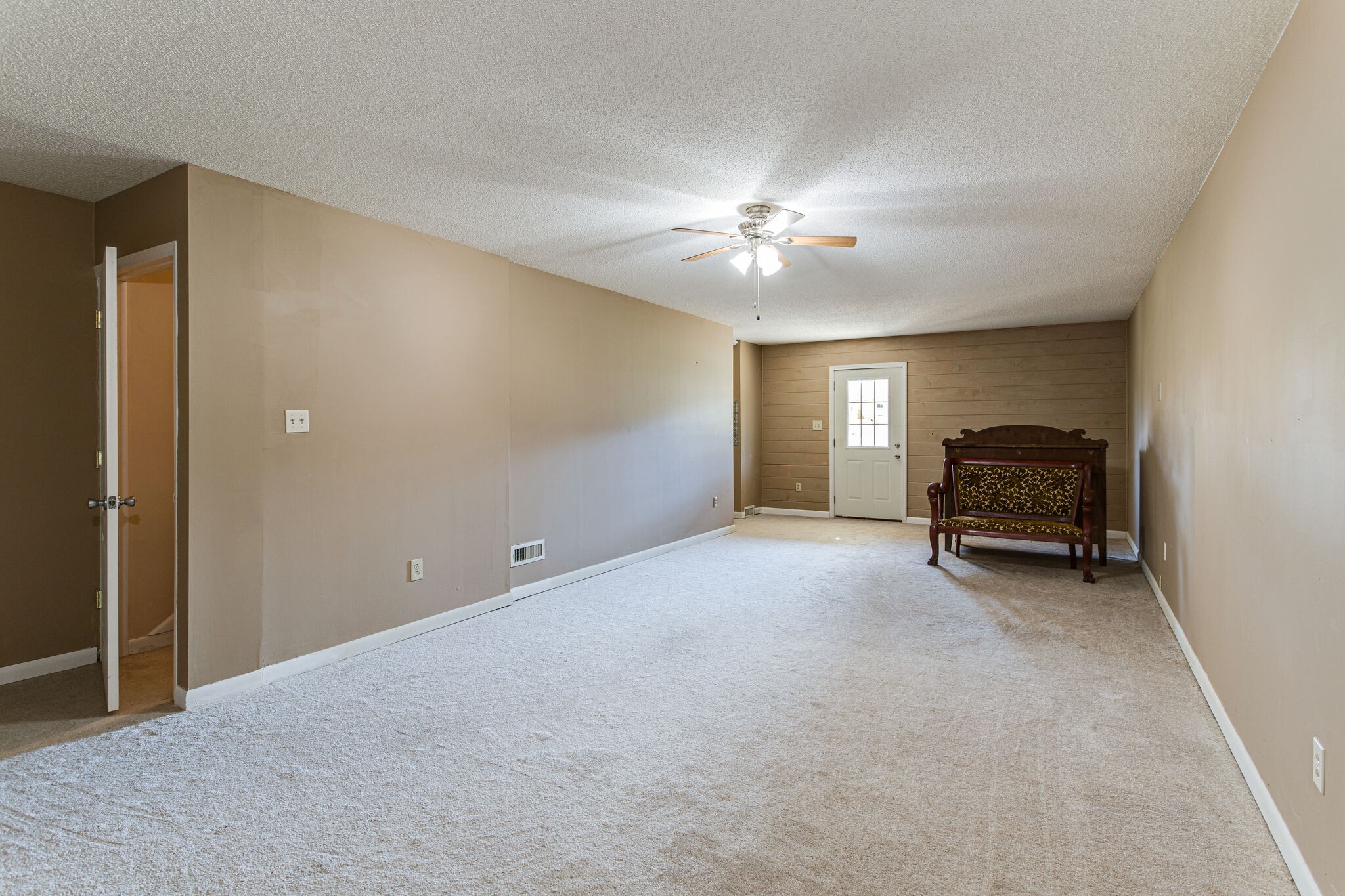 404 Monroe Floyd Road Decherd, TN 37324 - Photo 28 of 44 a view of livingroom with a ceiling fan and couch