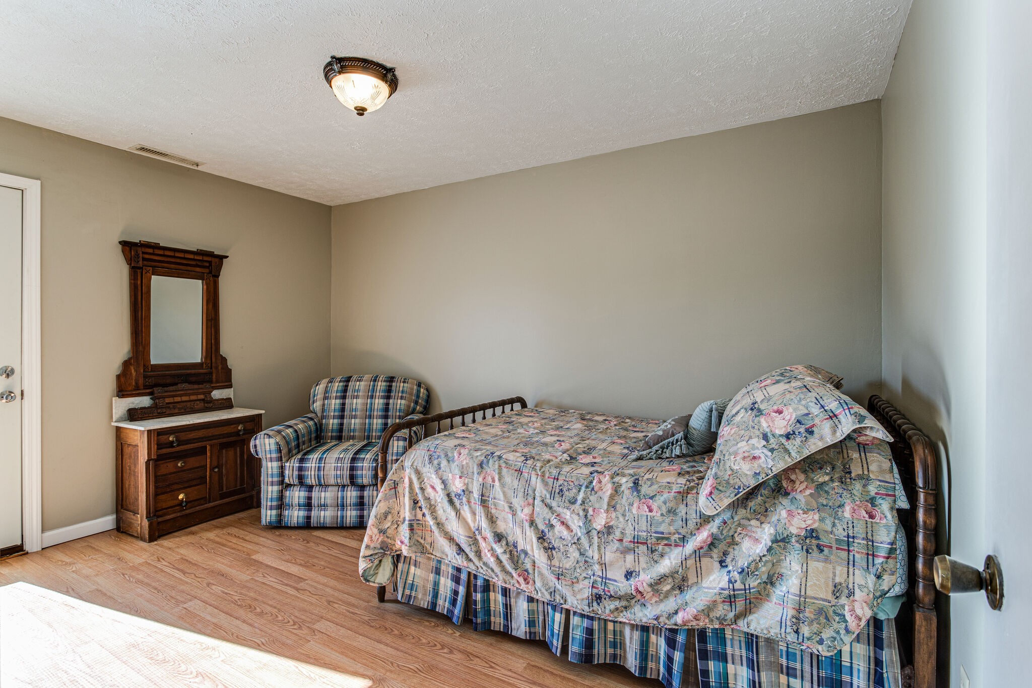 404 Monroe Floyd Road Decherd, TN 37324 - Photo 30 of 44 a bed sitting in a bedroom next to a larger window
