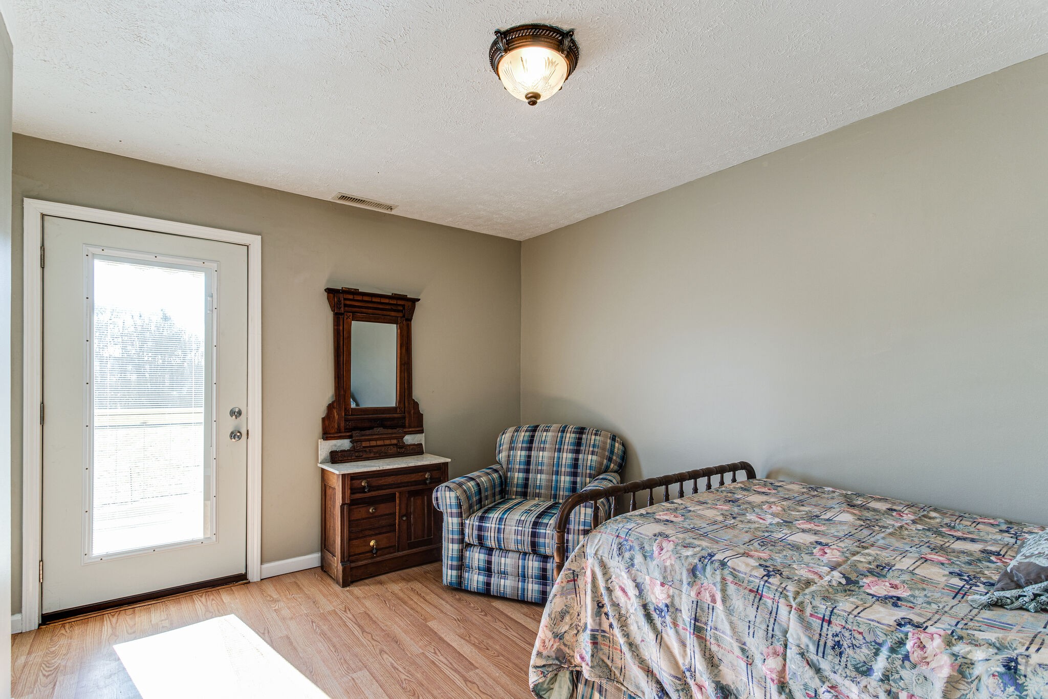 404 Monroe Floyd Road Decherd, TN 37324 - Photo 31 of 44 a bedroom with a bed and a window