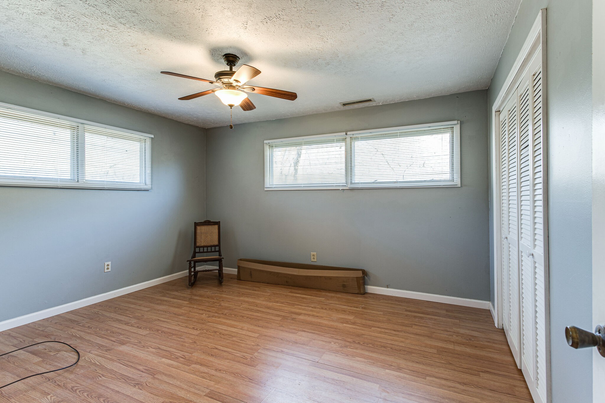 404 Monroe Floyd Road Decherd, TN 37324 - Photo 33 of 44 an empty room with wooden floor fan and windows
