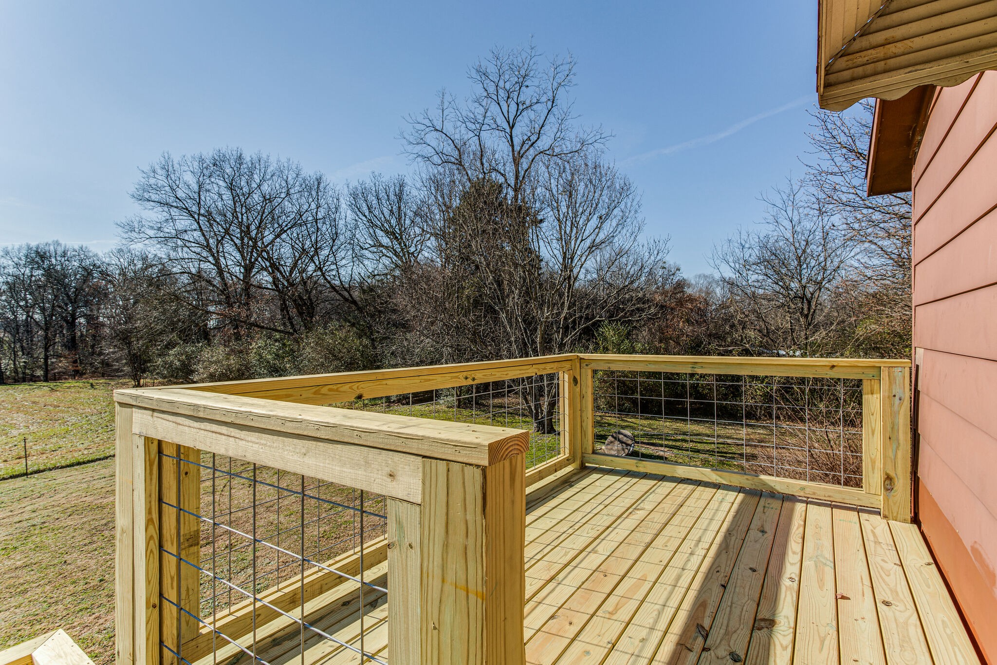 404 Monroe Floyd Road Decherd, TN 37324 - Photo 36 of 44 a view of a balcony with wooden floor and fence