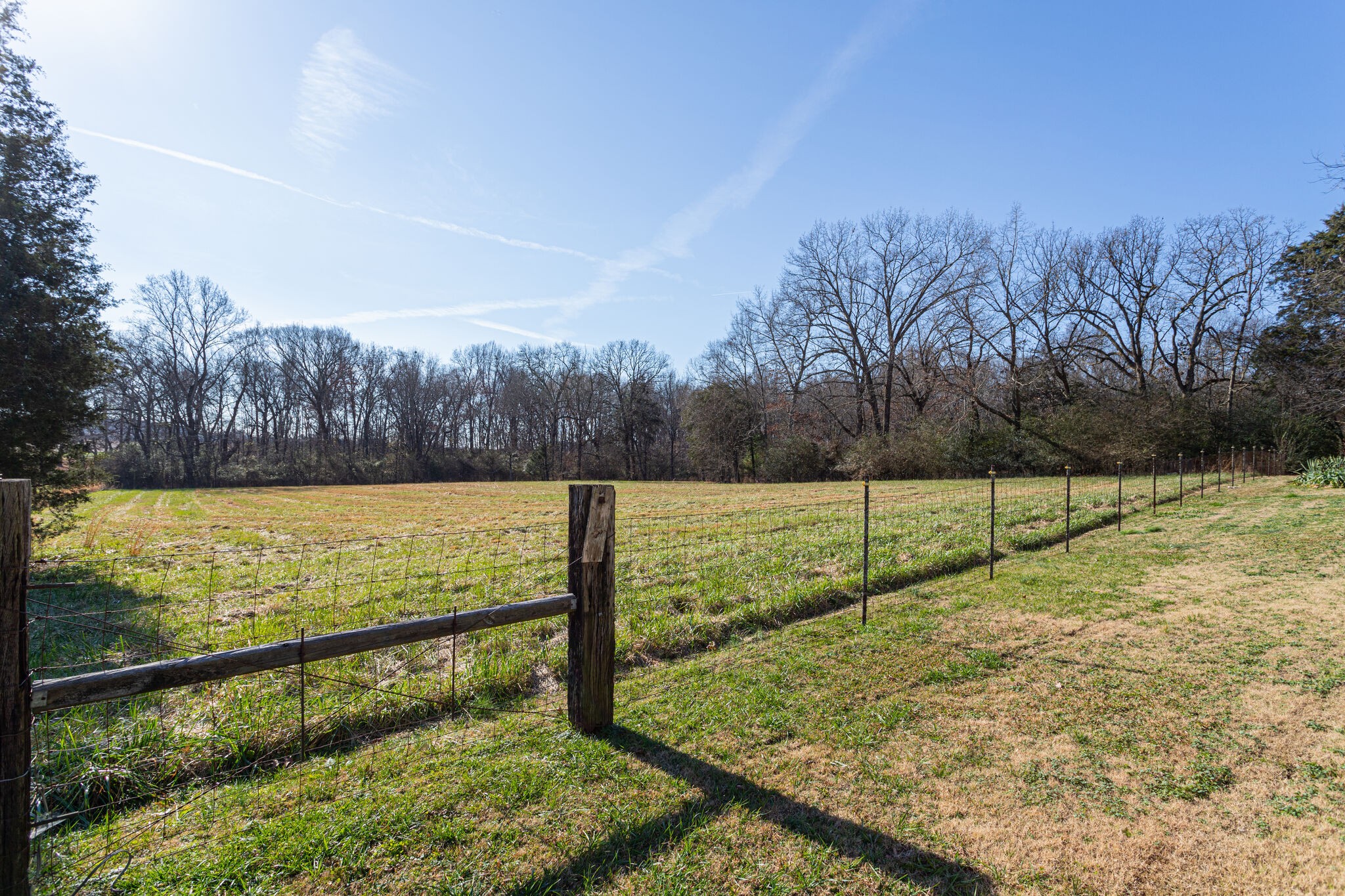 404 Monroe Floyd Road Decherd, TN 37324 - Photo 42 of 44 a view of a yard with wooden fence