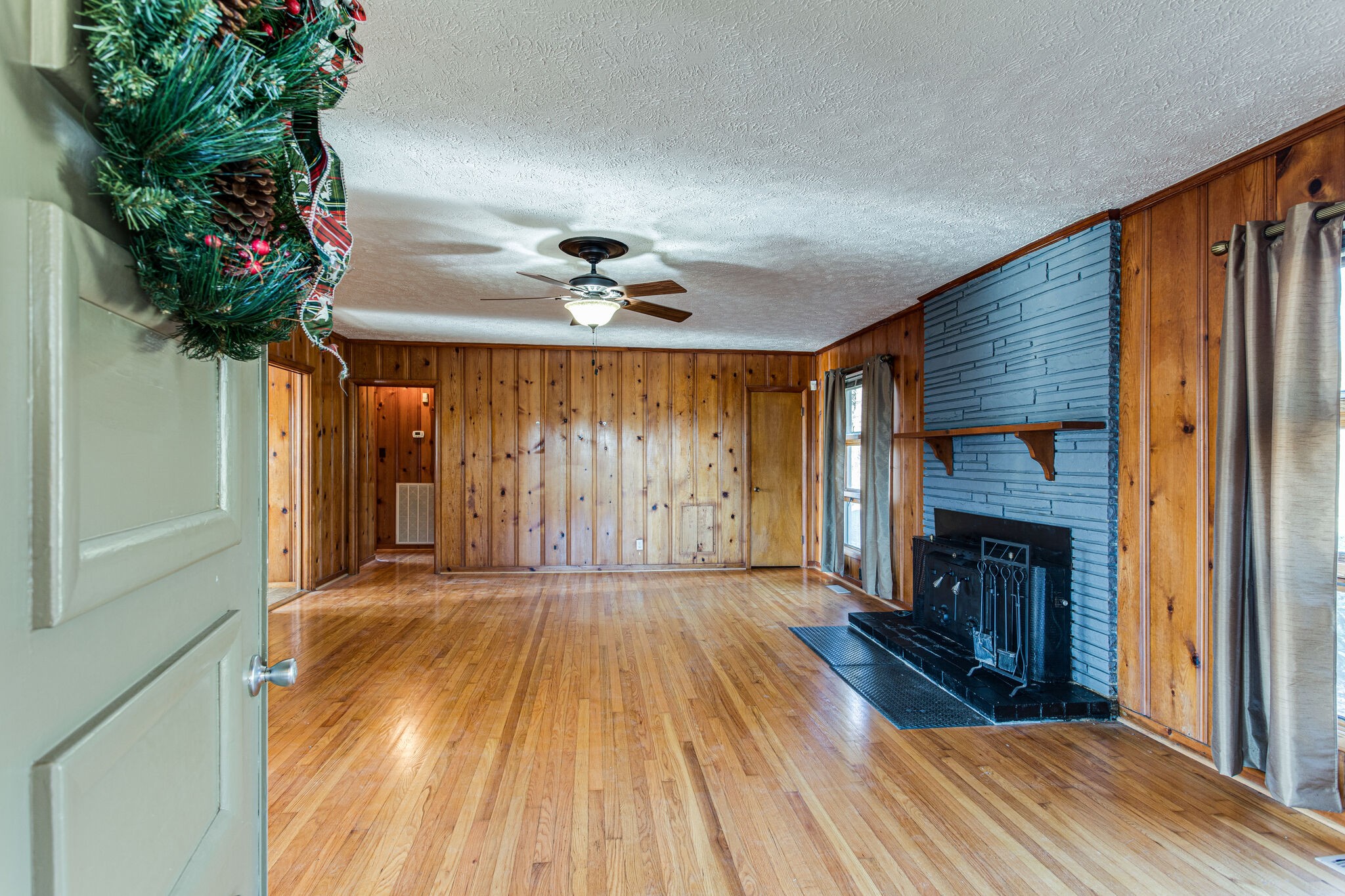 404 Monroe Floyd Road Decherd, TN 37324 - Photo 7 of 44 a view of empty room with wooden floor and a window