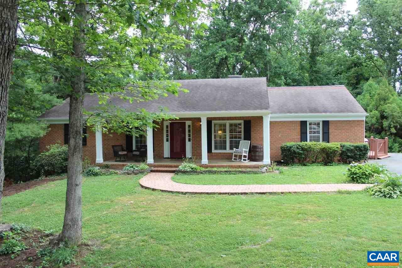 1724 Old Forge Road Charlottesville, VA 22901 - Photo 1 of 30 a white house with a small yard plants and large trees