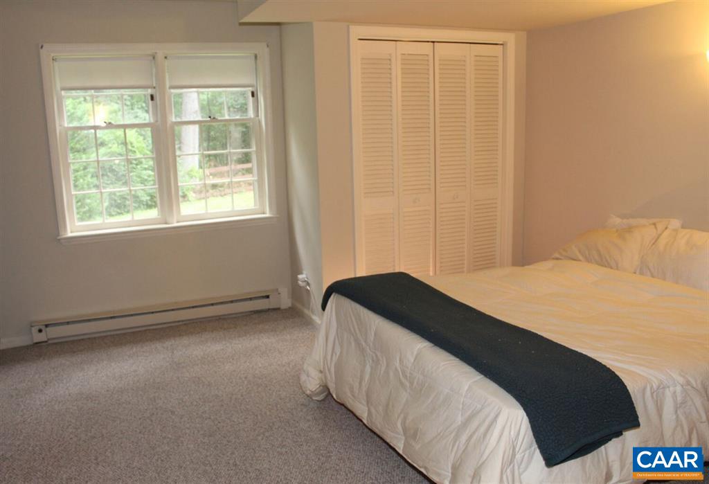 1724 Old Forge Road Charlottesville, VA 22901 - Photo 14 of 30 a bedroom with a bed and a window