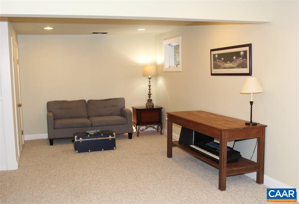 1724 Old Forge Road Charlottesville, VA 22901 - Photo 17 of 30 a living room with furniture and a table