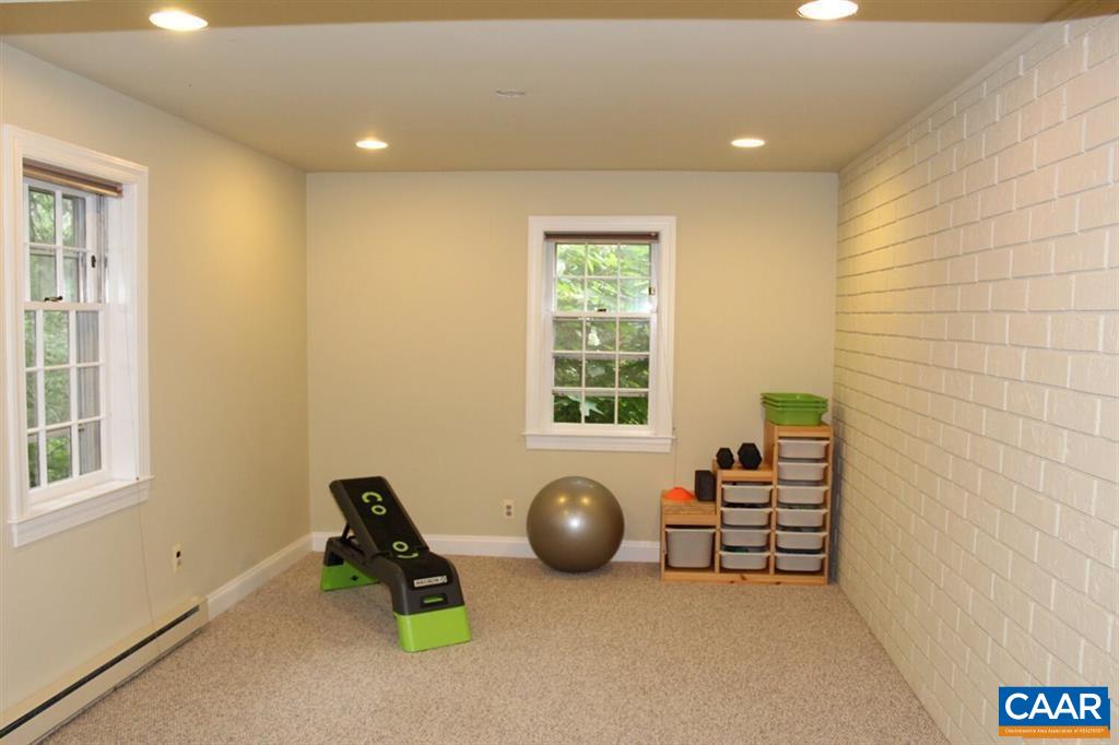 1724 Old Forge Road Charlottesville, VA 22901 - Photo 18 of 30 a room with gym equipment and windows