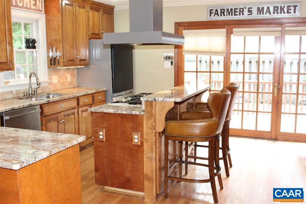 1724 Old Forge Road Charlottesville, VA 22901 - Photo 2 of 30 a kitchen with a table chairs and a window