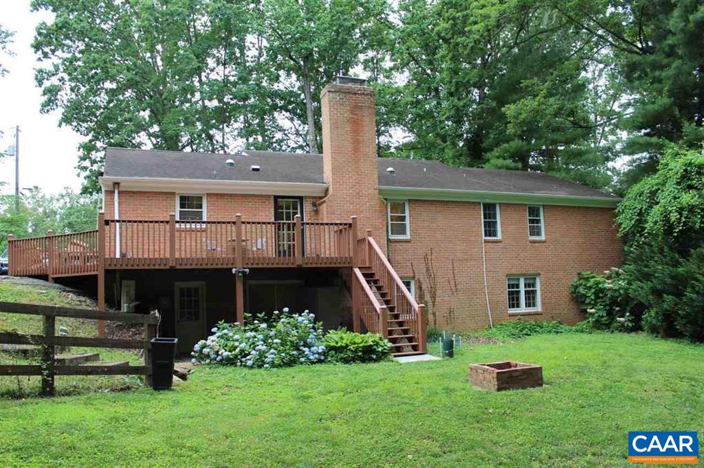 1724 Old Forge Road Charlottesville, VA 22901 - Photo 21 of 30 a front view of a house with a garden and plants