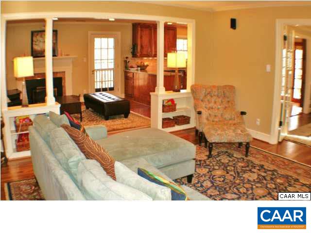 1724 Old Forge Road Charlottesville, VA 22901 - Photo 24 of 30 a living room with couches and dining table with wooden floor