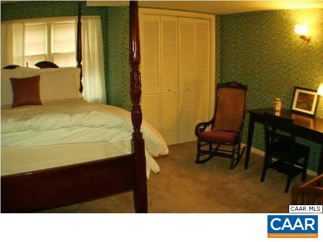 1724 Old Forge Road Charlottesville, VA 22901 - Photo 28 of 30 a room with a bed and a chair