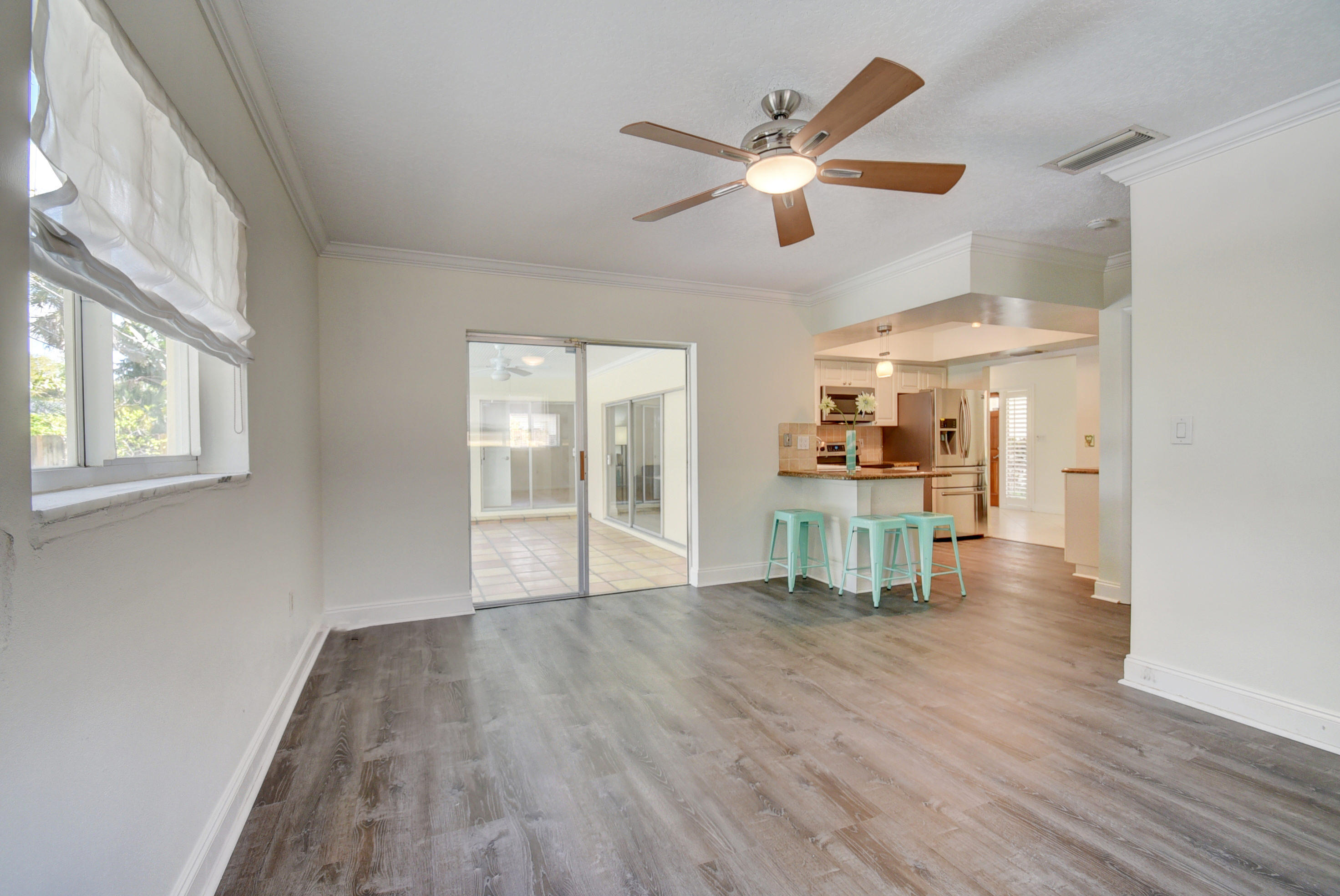 869 Periwinkle Street Boca Raton, FL 33486 - Photo 14 of 31 Family Room & Kitchen