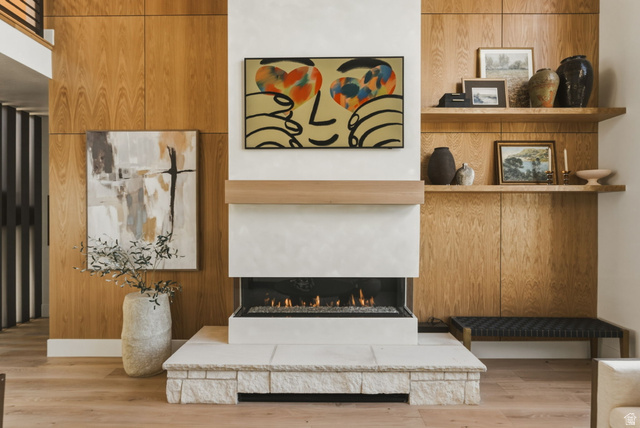 923 North Emery Lane Elk Ridge, UT 84651 - Photo 9 of 101 Fireplace featuring a stone hearth, gas insert, and light wood mantel