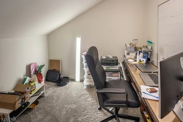 a view of a workspace with furniture